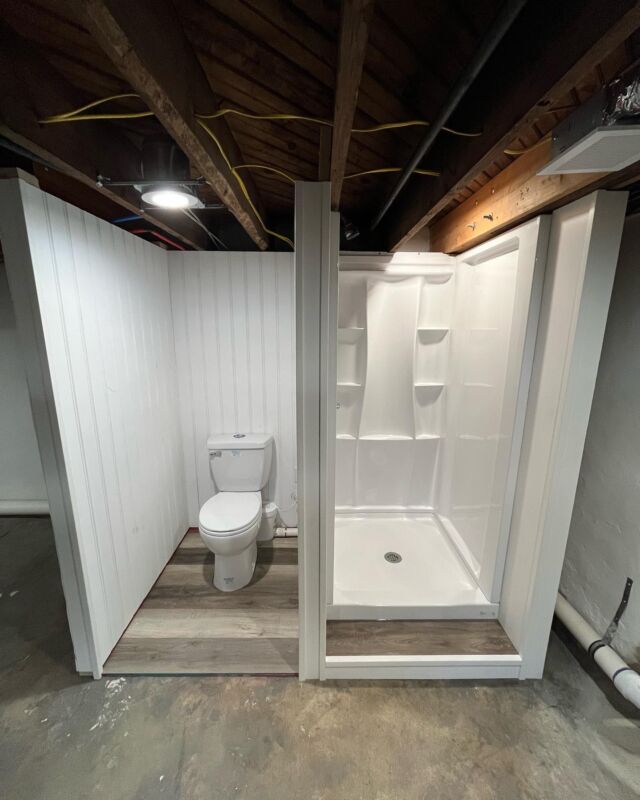 The “temporary” toilet/shower setup is complete for an upcoming renovation we’re doing in a home with only one bathroom. This basement has a 79” ceiling height and won’t be finished. The extremely low ceiling also required us to use a Saniflo toilet to pump the water up into the main sewer line. A higher ceiling would have allowed us to build a tall enough platform to use gravity instead in this particular situation.